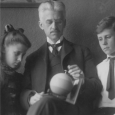 munsell holding color sphere with children