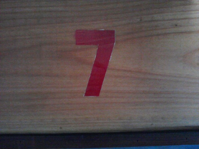 wood with number 7 painted on