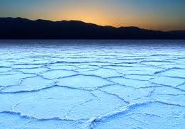 The light blue cracked surface of Badwater Basin in Death Valley, CA.