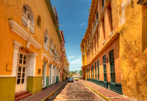 Orange-yellow colors of buildings on an old street in Cartagena, Columbia.