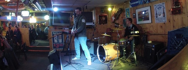 Punk Archaeology show - punk band playing music in the bar.