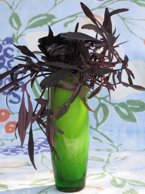 Burgundy Foliage in a Green Vase