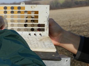 The Munsell soil color book being used in the field for assessing soils for wetland mitigation sites.
