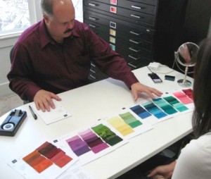 Personal Style Counselor John Kitchener lays out Munsell Color swatches to help analyse a clients color palette