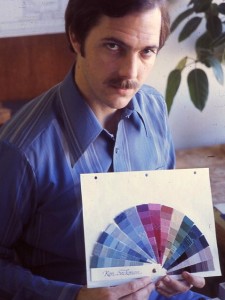 Ron Sackman in 1977 holding a fan of Munsell Color swatches