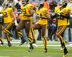 Denver Broncos in their old brown and gold football uniforms.