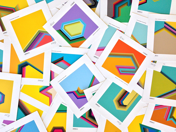 A pile of color swatches with various geometric patterns on white cards