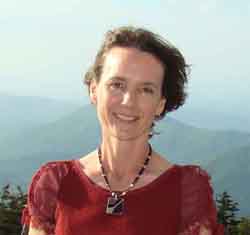 A photo of Kathryn Sampeck with mountains in the background