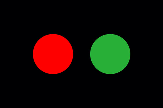 Red and green color signals on a black background