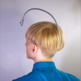 View of the antenna embedded in the back of Neil Harbisson's skull, a cyborg who perceives color via sound.