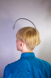 View of the antenna embedded in the back of Neil Harbisson's skull, a cyborg who perceives color via sound.