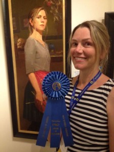 Aimee Erickson with her work, "Self Portrait with Key" awarded the Award of Excellence for Portraiture at the Oil Painters of America National Exhibition in 2014.