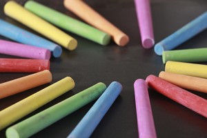 Colorful chalk in a spiral on a chalkboard