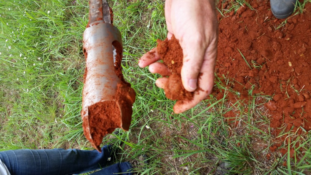 Auger sampling of clay soil from the historic Cherokee town site of Cowee, near Franklin, North Carolina. (Photo: Kathryn Sampeck)
