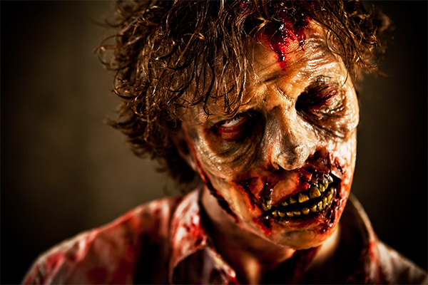 A realistic looking zombie showing skin colors in tans with blood stains