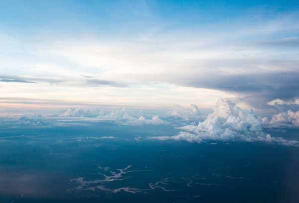 Blue hues in an aerial photo of sky and open space.