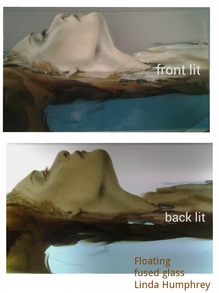 Floating, fused glass drawing by Linda Humphrey, showing the difference between front lit and back lit.