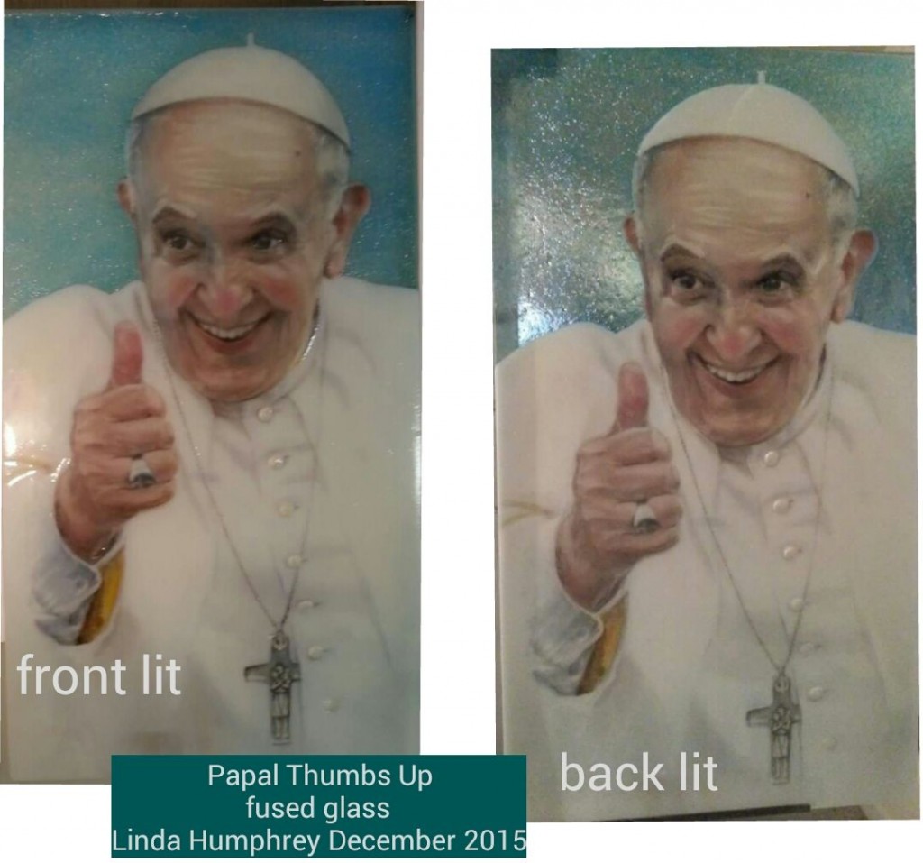 Papal Thumbs Up, fused glass drawing by Linda Humphrey, showing the difference between front lit and back lit.