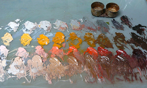A color palette with yellow, reds and browns