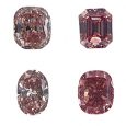 Four diamonds from the geological color chart shown in red hues