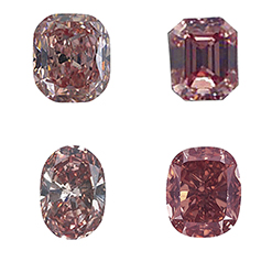 Four diamonds from the geological color chart shown in red hues